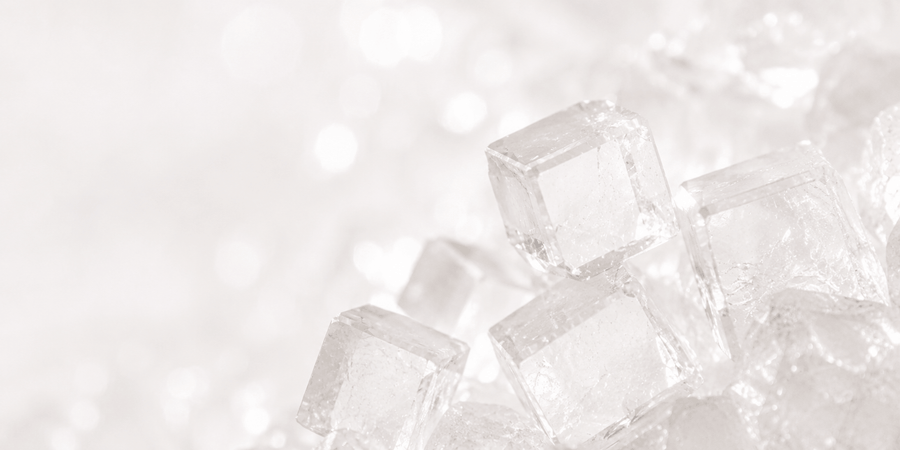 White sugar crystals representing D-mannose, a simple sugar for urinary support.